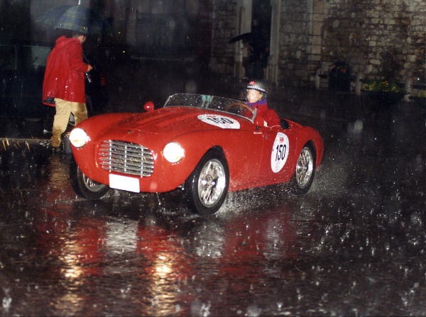 Sylvia Oberti driving in the rain in the Mille Miglia