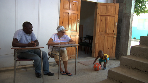Rose-Marie and Tony watching Valery play in Borgne, Haiti/Photo: Martina Rawdan