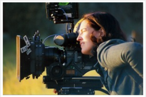Sascha Rice, filmmaker looking through camera on the set. Photo: Elliot-Schackne
