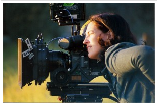 Sascha Rice, filmmaker looking through camera on the set. Photo: Elliot-Schackne