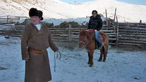 Martina Radwan on horseback in Mongolia