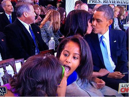 Malia photobombing Sasha's attempt to catch a Presidential Kiss - Inauguration 2013 | Credit: Credit: CNN.com screenshot by @KerstinShamberg via The Atlantic Wire