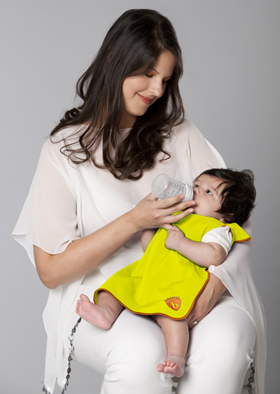 Mom feeding baby wearing Bibbetec bib | Photo given to TWE by Susie Taylor