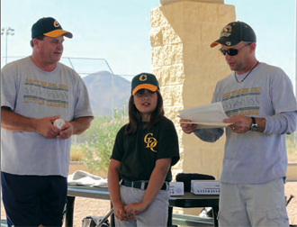 Christine-Taylor with her Little League coaches