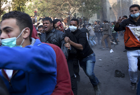 The wounded are evacuated as protesters clashed with Egyptian military as a crowd of tens of thousands filled Cairo's Tahrir Square/Photo: Heidi Levine, Sipa Press
