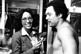 One of the first female sportswriters interviewing a player in the locker room