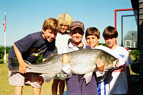 Melinda Fager's photo of son jack with striped bass and friends