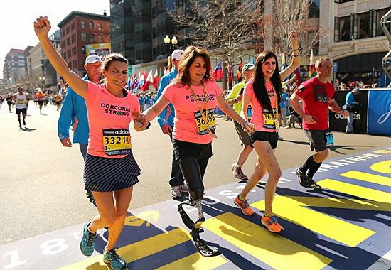 Corcoran family crosses Boston Marathon finish line/2014/Boston Globe
