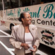 Estella Pyfrom standing in front of her Brilliant Bus