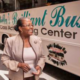 Estella Pyfrom standing in front of her Brilliant Bus mobile computer training center
