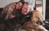 Lourdes Garcia-Navarro with her husband, James Hider, and their dogs Nena (left) and Ursa.