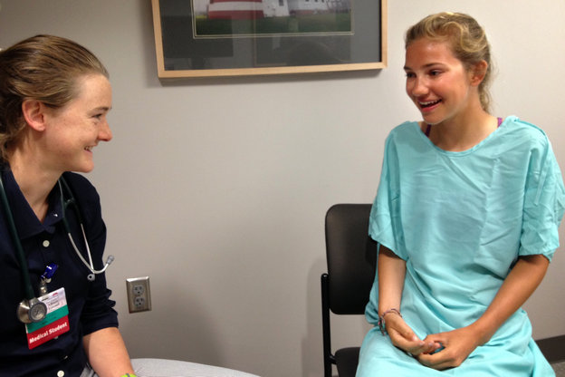 Allie Tetreault talks to pretend patient Gabrielle Nuki at Maine Medical Center
