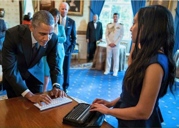 Haben Girma talking to President Obama using digital Braille device/White House Photo courtesy Haben Girma