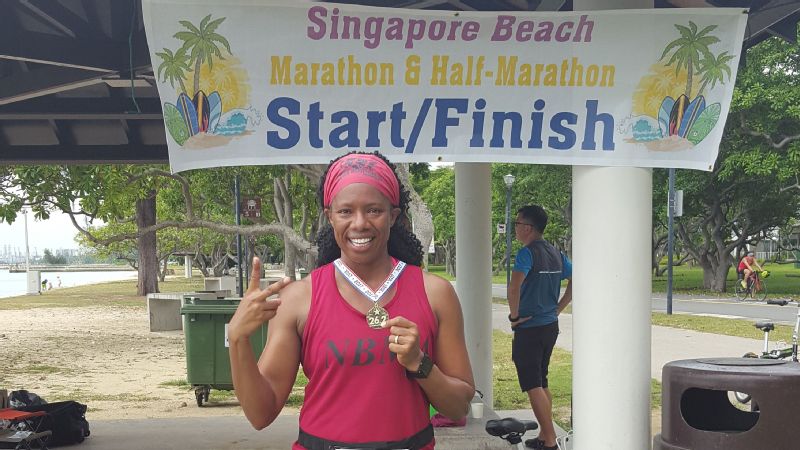 Lisa Davis, marathon runner at finish line in Singapore/Photo: Lisa Davis