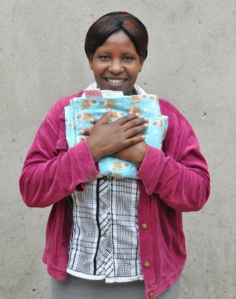 Andra Good's Leigh's Blankies group gives blankie to person in Africa/Photo on Andra's website