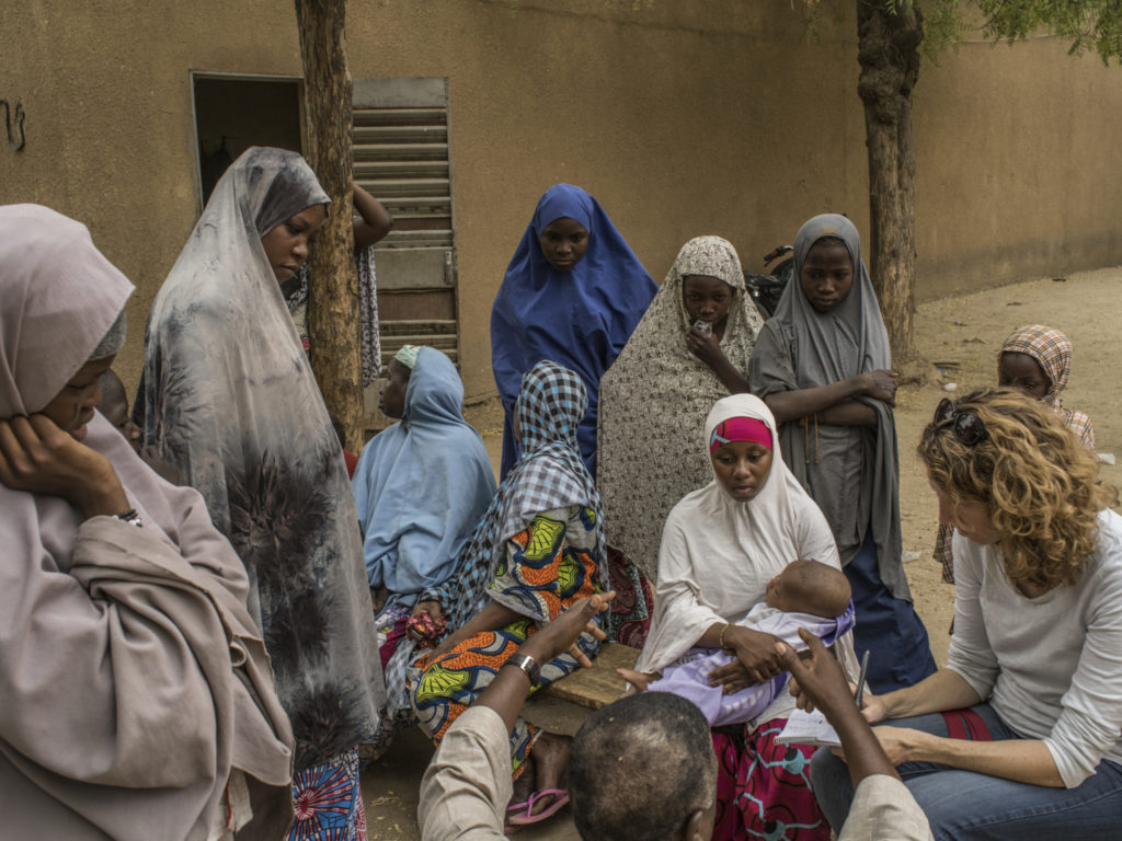 Dionne Searcey in Niger taking notes for a story/Photo: Laura Boushnak