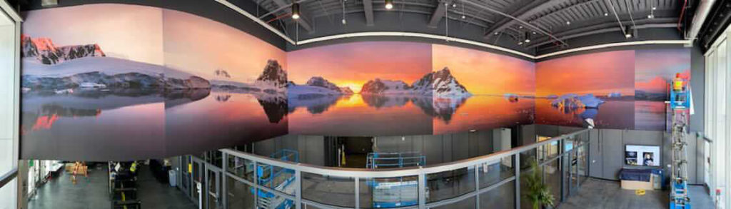 Camille’s polar images on display, spreading over three walls at the new Facebook buildings in Burlingame, CA. Courtesy: Kristin Farr, Facebook Open Arts