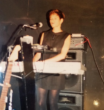 Mindy Uhrlaub, author-activist, playing keyboard for the band 40th Day/Courtesy a 40th Day fan
