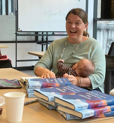 Maggie Doyne, cofounder BlinkNow, multitasking with baby Everest at booksigning/Photo: Courtesy Maggie Doyne
