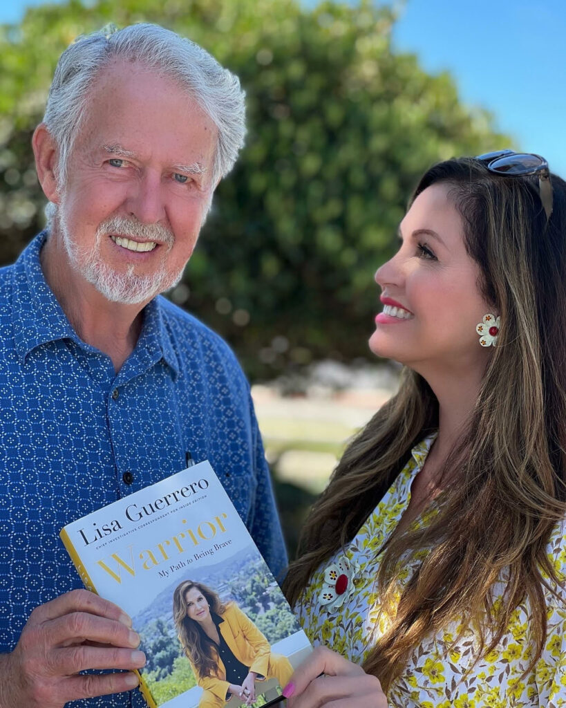 Lisa Guerrero with her father holding her new memoir, Warrior: My Path to Being Brave : Photo: Courtesy Lisa Guerrero
