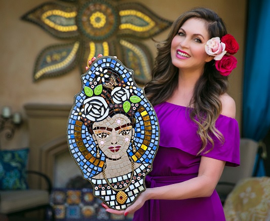Lisa Guerrero holding up one of her mosaic images | Photo: Courtesy Lisa Guerrero
