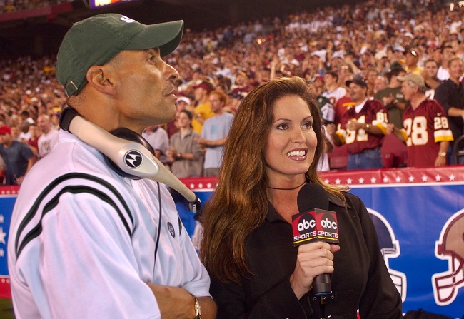 MONDAY NIGHT FOOTBALL - Lisa Guerrero (ABC/Ida Mae Astute)--interviewing 
New York Jets head coach Herman Edwards, 2003