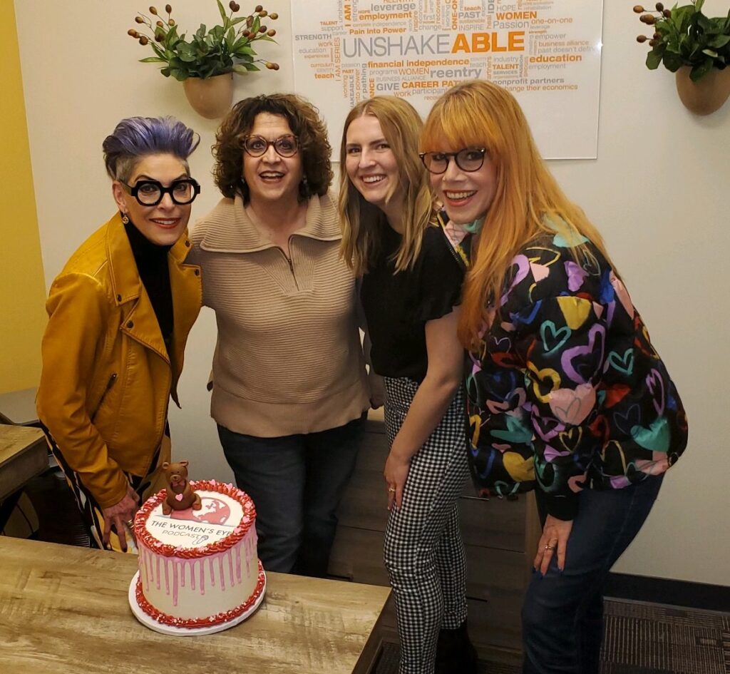 UNSHAKEABLE Team receives TWE cake (from lft): Barbra Jo Batterman, founder Debbie Isaacs, Lauren McAllister with TWE contributor Stacey Gualandi