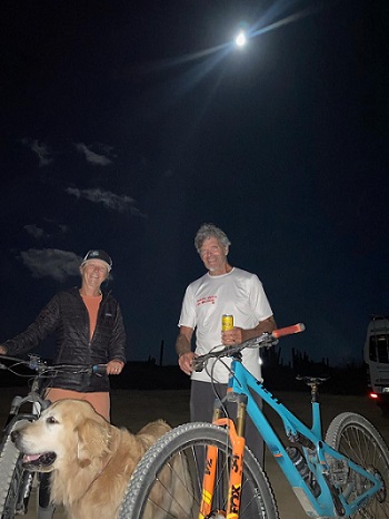 Alenka Vrecek, author She Rides, and husband Jim bikeriding by the light of the moon/Photo: Courtesy Alenka Vrecek